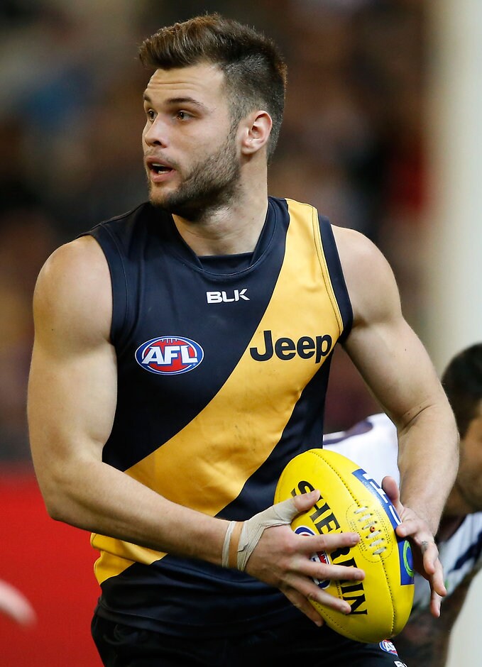 AFL 2015 Rd 17 - Richmond v Fremantle MELBOURNE, AUSTRALIA - JULY 25: Ben Lennon of the Tigers in action during the 2015 AFL round 17 match between the Richmond Tigers and the Fremantle Dockers at the Melbourne Cricket Ground, Melbourne, Australia on July 25, 2015. (Photo by Adam Trafford/AFL Media)